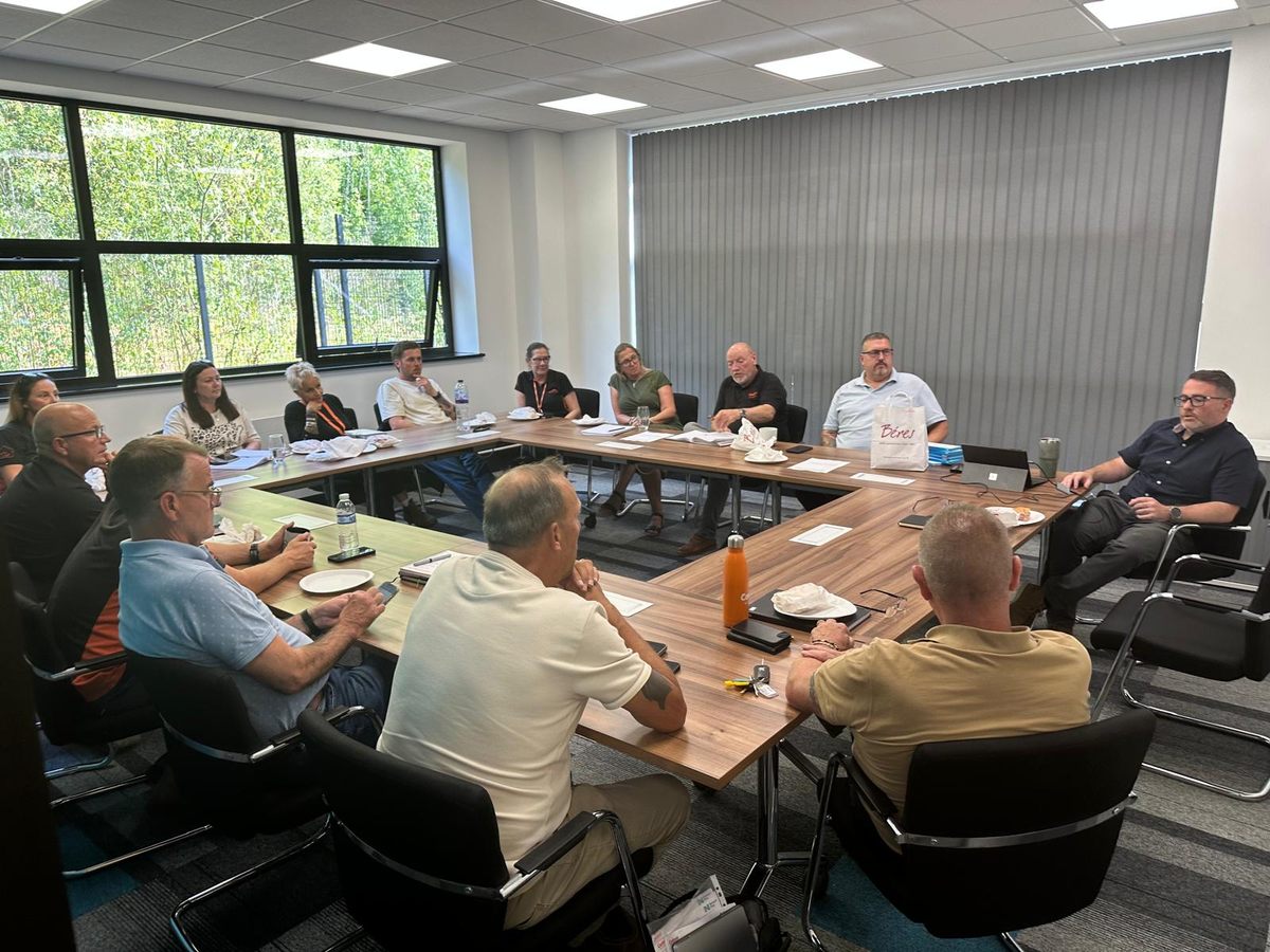SAUK management team around the table at the Sheffield office