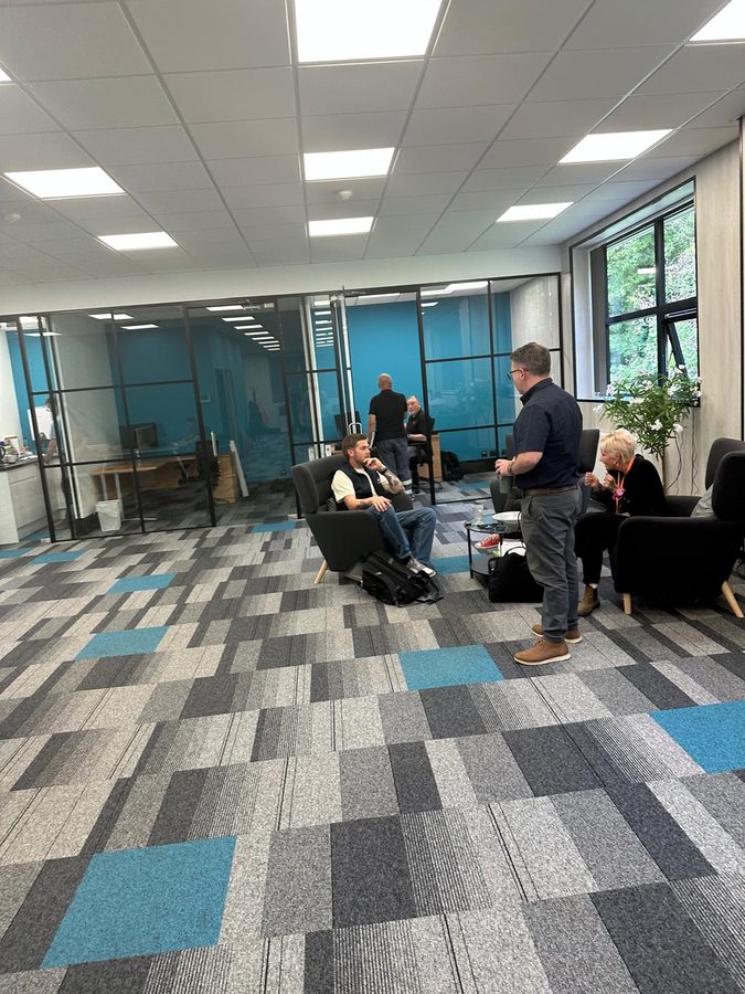 Managers talking at the Sheffield office