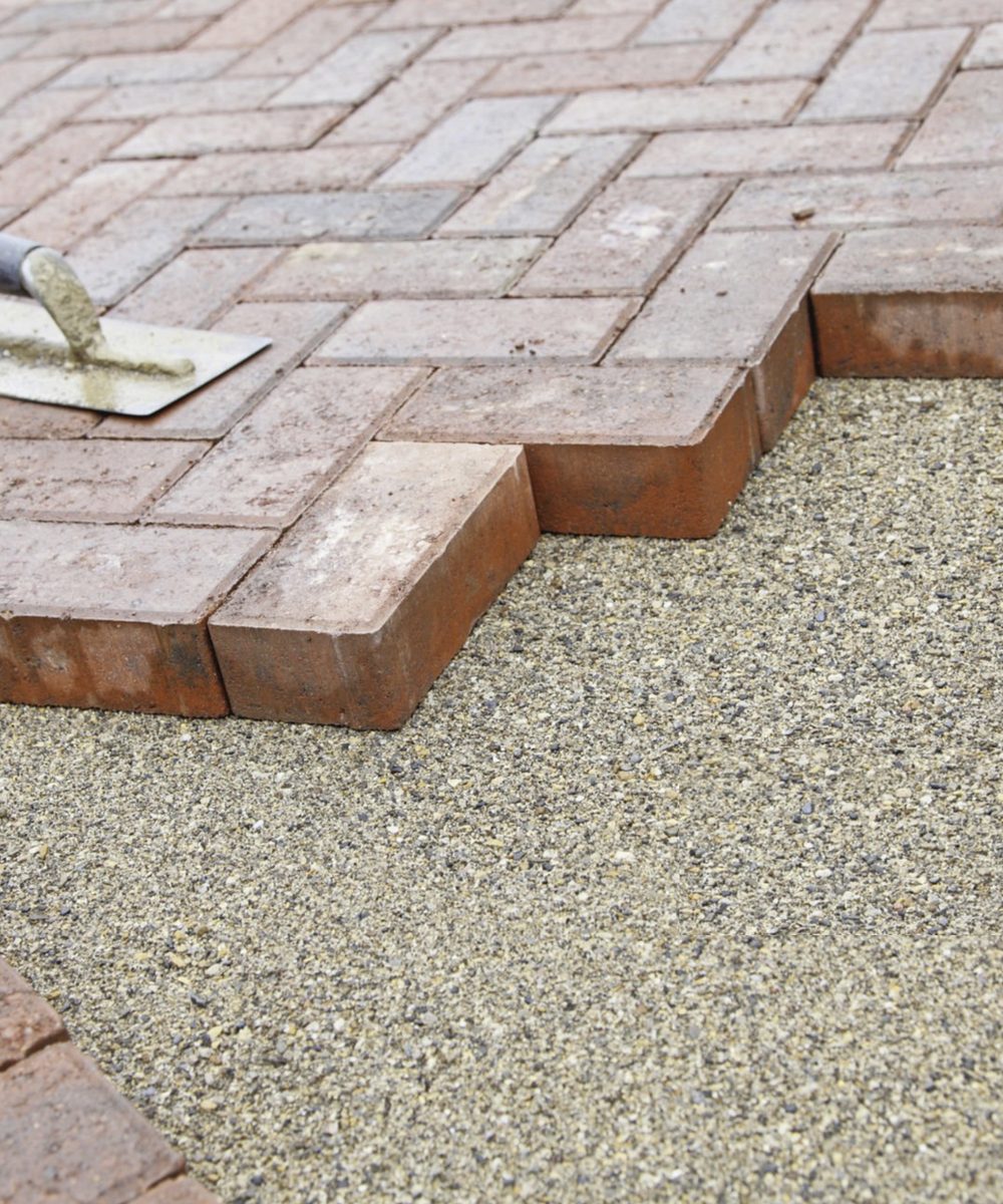 Flags and modular paving relaid on a driveway